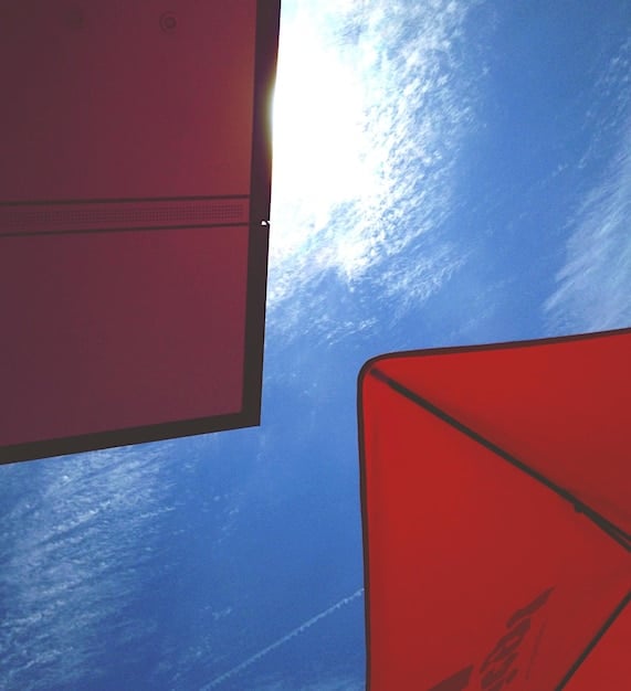 A photograph of a US cargo ship unloading goods at a Chinese port, illustrating the flow of trade between the two countries as a result of the trade agreement. The focus should be on the activity and scale of the trade operation.