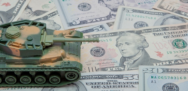 A graph illustrating the increase in US military spending during the Iraq and Afghanistan wars, compared to pre-war levels, with annotations pointing out specific years and dollar amounts.